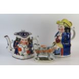 A reproduction Staffordshire pottery toby jug and cover of traditional design, 23cm high, a double