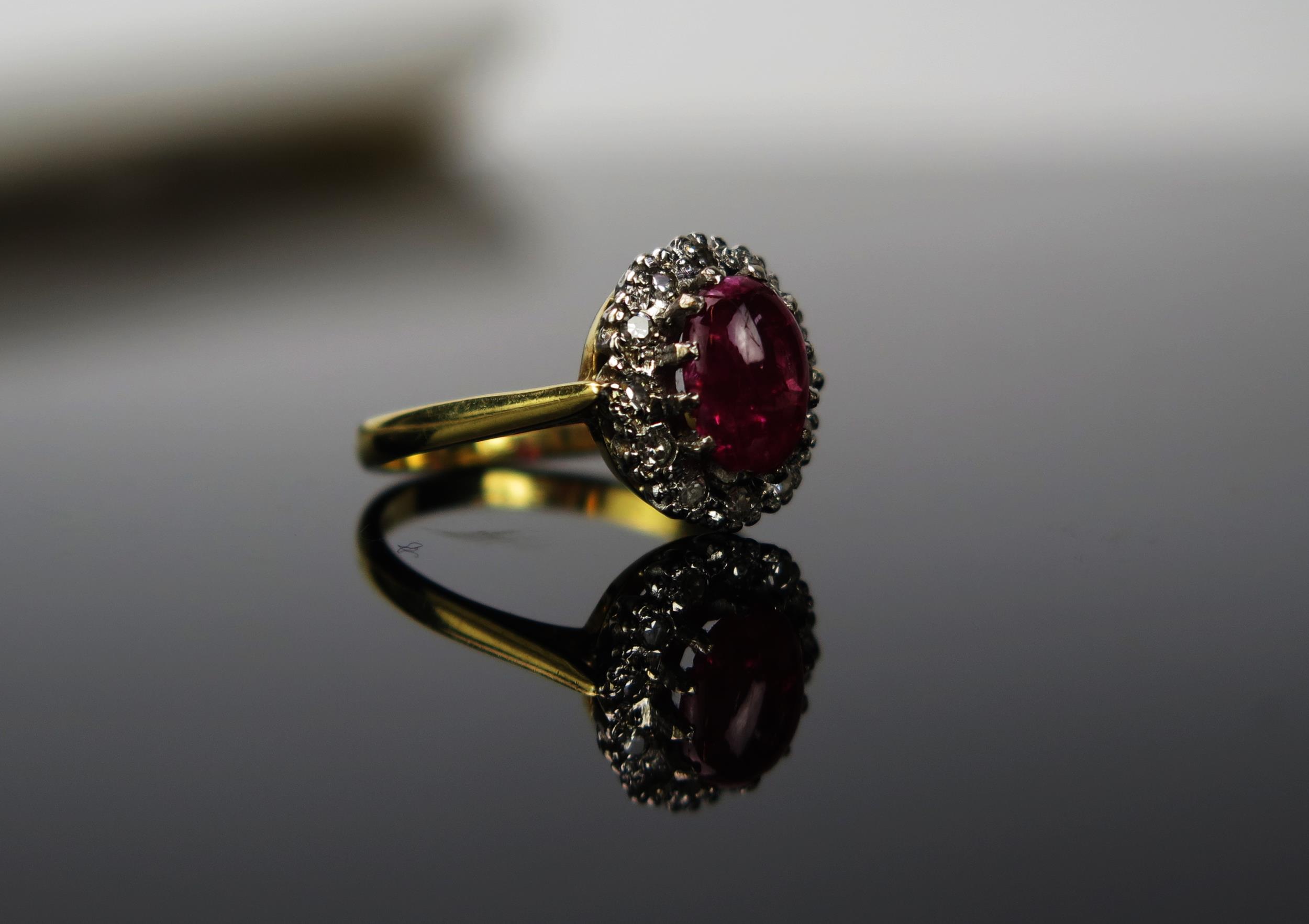 A Red Stone and Diamond chip 18ct gold ring, the cabochon stone approximately 6cm long, stamped 750, - Image 2 of 2