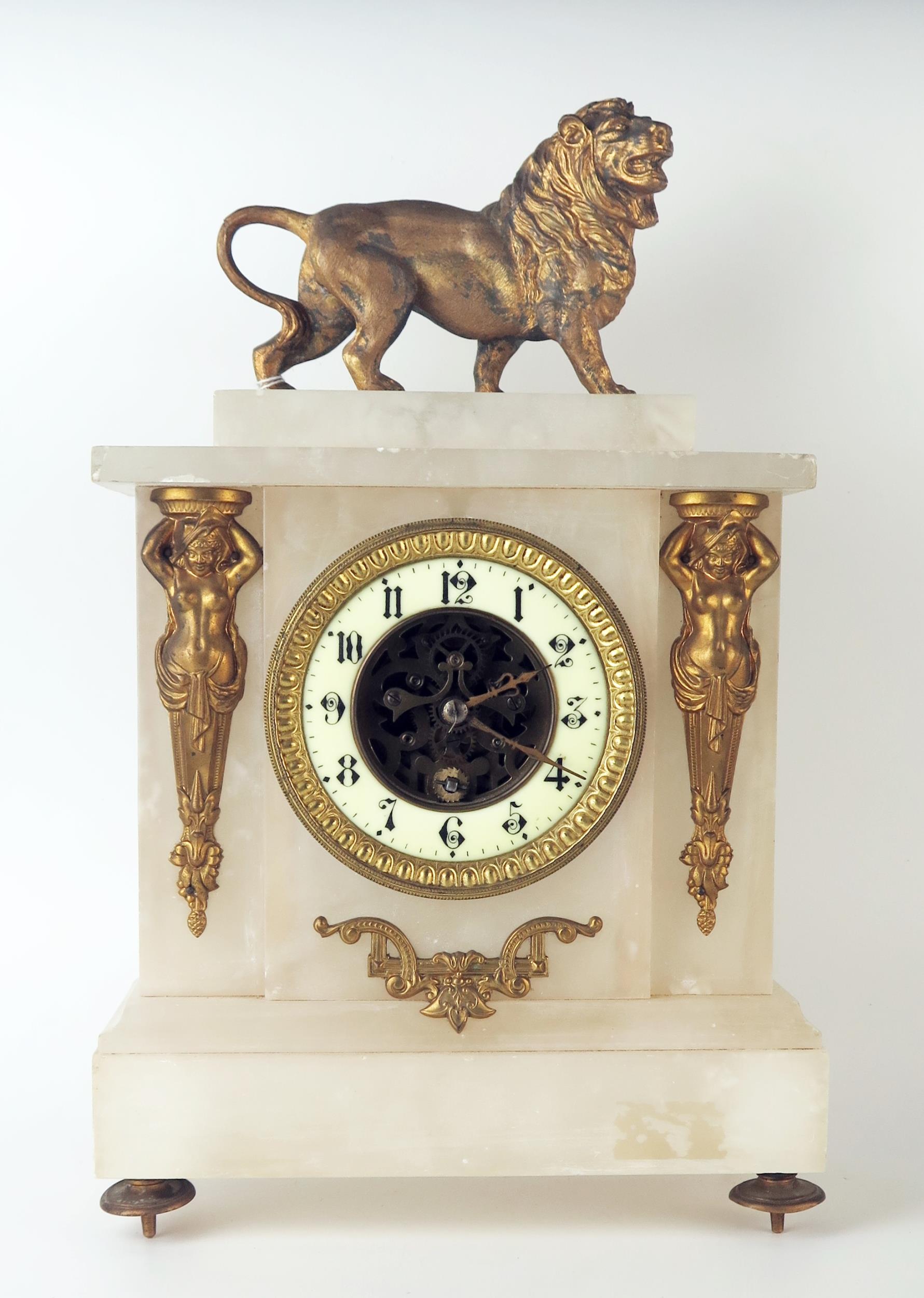 A late 19th century alabaster and gilt metal mounted mantel timepiece, of rectangular outline,