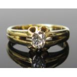 An 18ct Gold and Diamond Solitaire Ring, the oval c. 5.1x4.2mm old cut stone kin a claw setting,