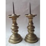 A pair of 19th century pricket candlesticks, with knopped stems and domed circular bases, 36cm high