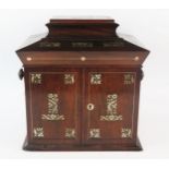 A William IV period rosewood and mother-of-pearl inlaid table top sewing cabinet, with hinged