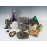 A collection of assorted geological specimens, including a malachite panelled pyramid, an amethyst