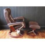 An Ekornes brown leather upholstered 'Stressless' swivel chair, with adjustable seat on a chrome and
