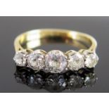 A Diamond Five Stone Ring in an 18ct gold and platinum setting, central stone 5mm diam., size P.5,