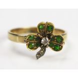An Antique Diamond and Green Stone Clover Ring in an unmarked gold setting, size R.75, 3.2g