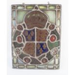 A stained glass panel depicting the Royal Coat of Arms for Richard III enclosed by red and white