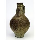 A 17th century Bellermine bottle, of ovoid form with traditional bearded mask decoration to the