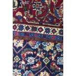 A Persian Mood carpet, with central field with ivory and wine red pole medallion and all over