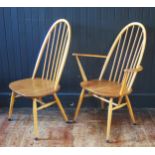 An Ercol blonde Quaker elbow chair and standard dining chair, with arched spindle backs and