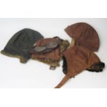 Two mid 1920's brown leather brown leather flying helmets one with goggles and a German black