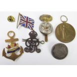 A collection of patriotic pins, WWI Victory Medal , cap badges etc.