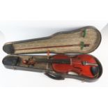 A three quarter size violin, the two-piece back of a honey brown varnish. length of back 33.
