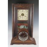 An Edwardian mahogany and inlaid mantel clock of arched outline, with 15cm ivorine Arabic chapter