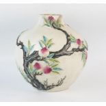 A Chinese pottery bottle vase, of ovoid form, with low relief fruit and foliate decoration, (neck