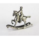 A Continental silver novelty miniature rocking horse and rider, bears import marks for Singleton