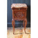 A French walnut bedside cabinet, of serpentine outline, with inset marble top, with single short