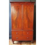 A 19th century mahogany linen press, with moulded cornice above a pair of plain field cupboard
