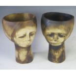 A pair of modernist pottery head vases, each 25cm high.