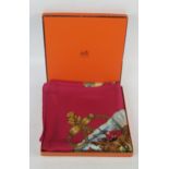 Hermes, Paris, a printed silk scarf 'Brise de Charme' pattern : 85 x 90cm. in original orange Hermes