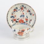 A Chinese export porcelain cup and saucer, decorated in the Imari palette.