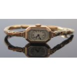 A 9ct Gold Cased Ladies Wristwatch on 9ct gold spring loaded bracelet, 21x14mm case with Swiss