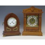 A mahogany and brass strung lancet-shaped mantel clock, with 10cm Arabic/Roman dial, the circular