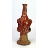 A late 17th century continental slipware bottle with masque decoration, possibly Italian, 28cm high,