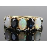 A 9ct Gold, Opal and Sapphire Five Stone Ring, largest singlet opal c. 5.8x3.8mm, London