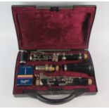 Buffet, a B12 five piece clarinet, with spare reeds contained in a fitted carrying case