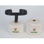 Two ROLEX Watch Stands, one missing clip