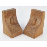 A pair of "Mouseman" chip carved pair of oak bookends, 15.5cm high.