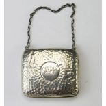 An Edward VII beaten silver purse, maker S & Co Birmingham, 1906, monogrammed, of rectangular form