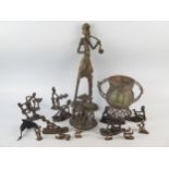 A collection of Benin bronze erotic figures, various poses and sizes, a two handled bronze vase,