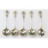 A set of five white metal spoons, with lobed bowls slender stems with foliate terminals, 52gms, 1.