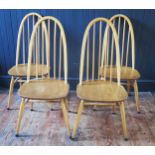 A set of four blonde Quaker style dining chairs, with arched spindle backs, solid seats on
