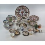 A mixed collection of Chinese and Japanese ceramics, including, rice wine bowls, Saki bowls,
