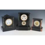 A late Victorian polished slate mantel clock, of rectangular outline, having a 10cm Roman dial,