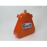 A repainted replica Gulf petrol can with brass can, 24cm high.