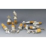 A collection of English and continental silver and plated bottle stoppers, modelled as galleon,
