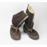 A pair of sheepskin lined flying boots, with zip fronts and tightening strap.