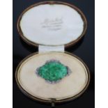 An 18ct White Gold and Diamond Brooch with Carved and Pierced Jadeite Panel in original Muir Nicol