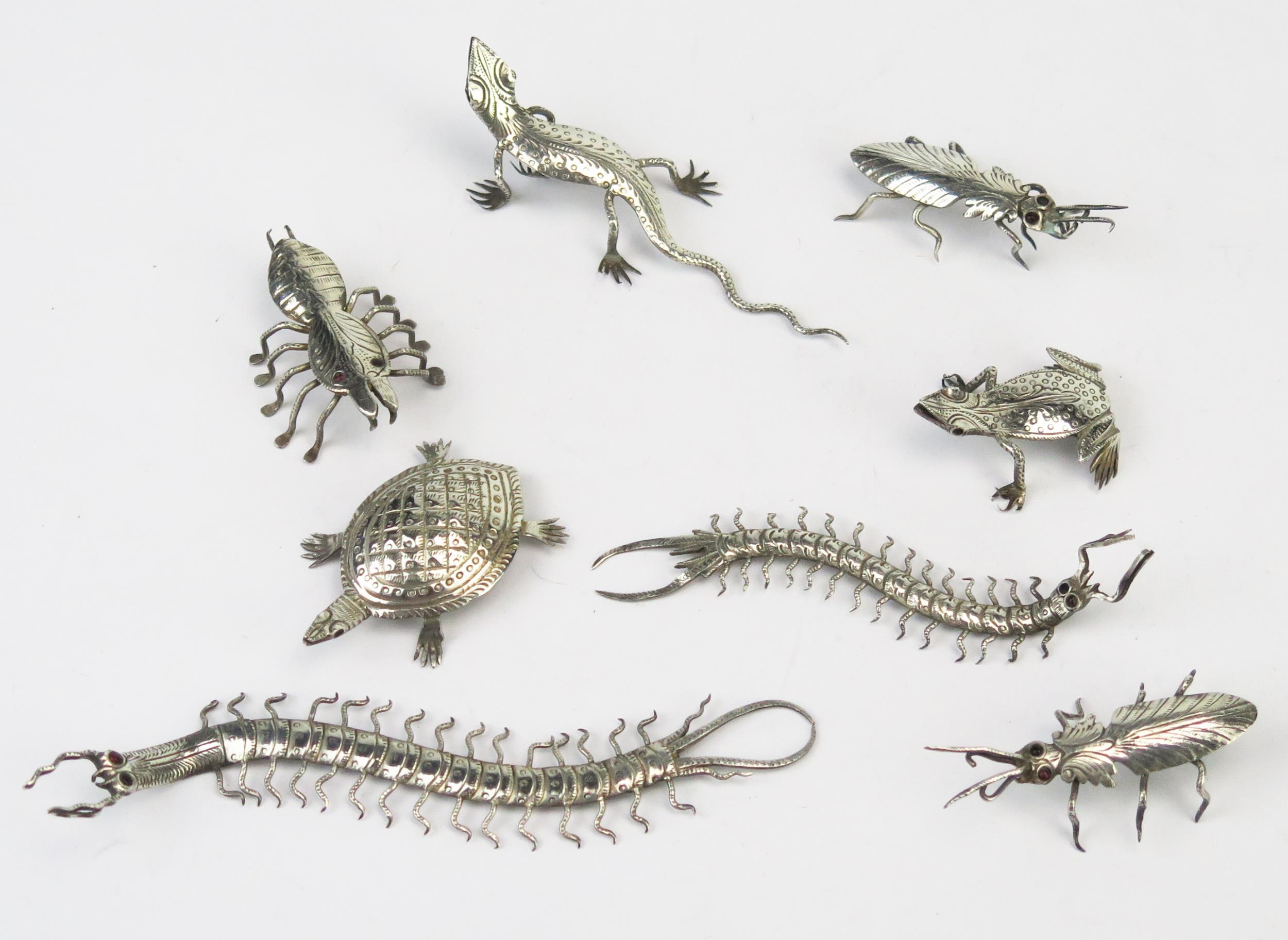 A collection of Indian silver menu holders modelled as insects, lizard and other beetles, total