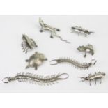 A collection of Indian silver menu holders modelled as insects, lizard and other beetles, total