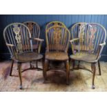 A set of six elm stick back dining chairs, with pierced central splat, solid seats on turned legs