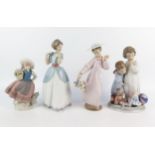 Four LLadro porcelain figurines, all of young children, 17cm and 23cm high, (4).