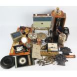 An assortment of collectables including barometers, brass trivet, call bell, radio etc.
