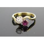 An 18ct Gold, Ruby and Diamond Crossover Ring, ruby c. 4.2mm diam. and diamond c. 4mm, size K, 3.1g