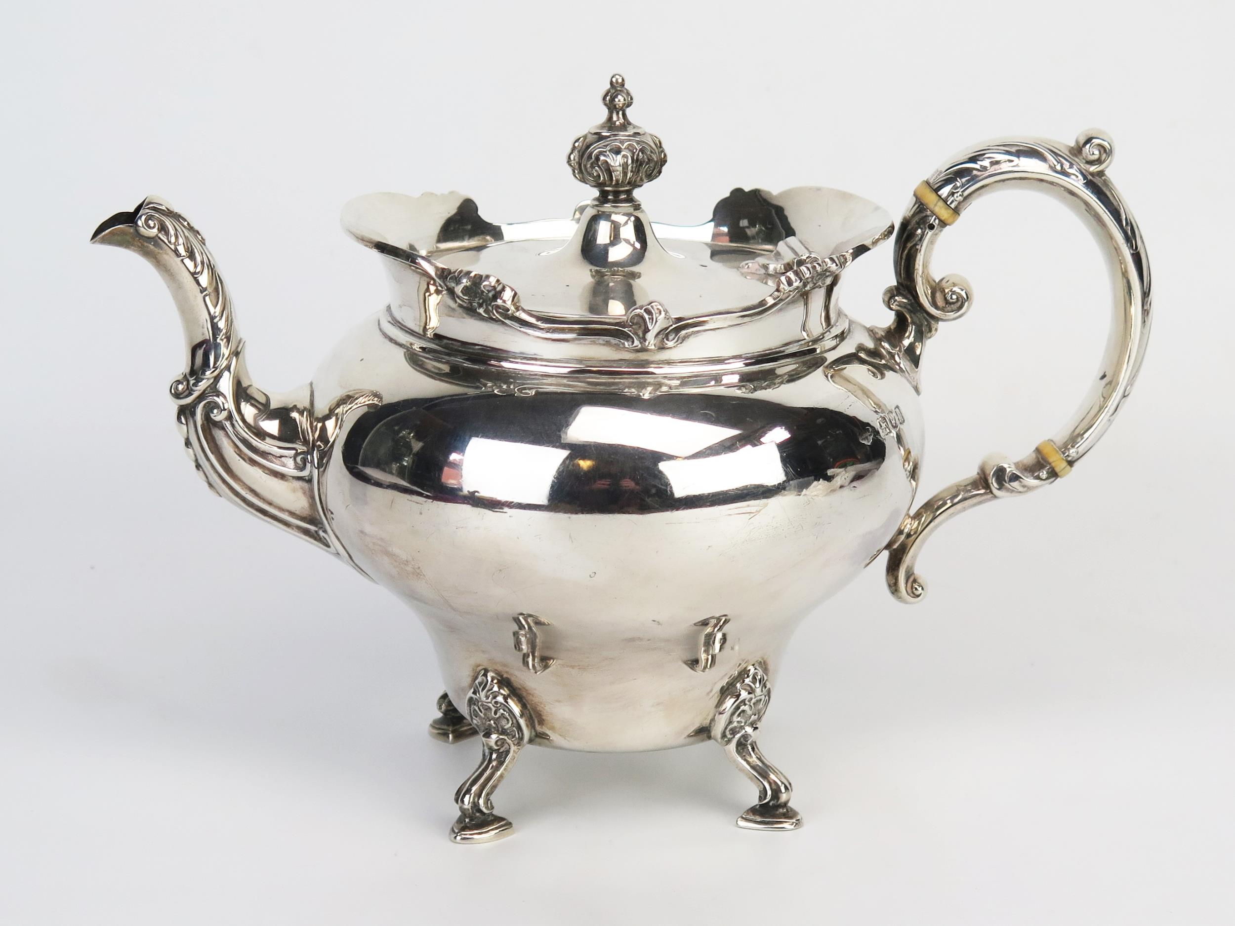 An Edward VII silver teapot, maker Goldsmiths & Silversmiths Co Ltd, London, 1903, of ovoid form,