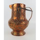 A late 18th century copper jug and cover, bears embossed coat of arms, stylised lions, with scroll